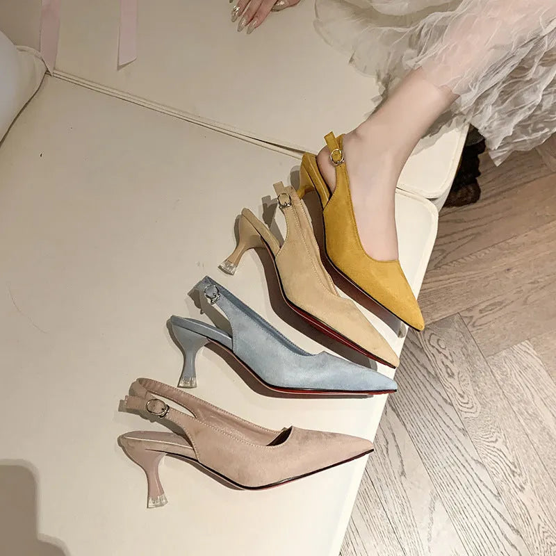 A pair of apricot suede pointed toe stiletto high heels with a rubber sole.