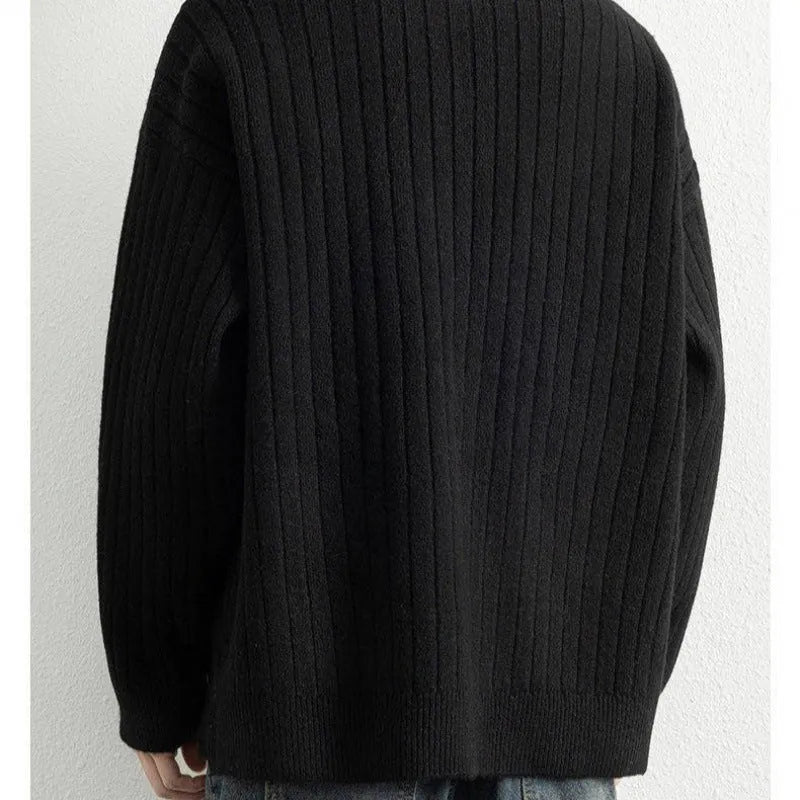 Grey half-zip loose knit sweater for men with long sleeves on a hanger.