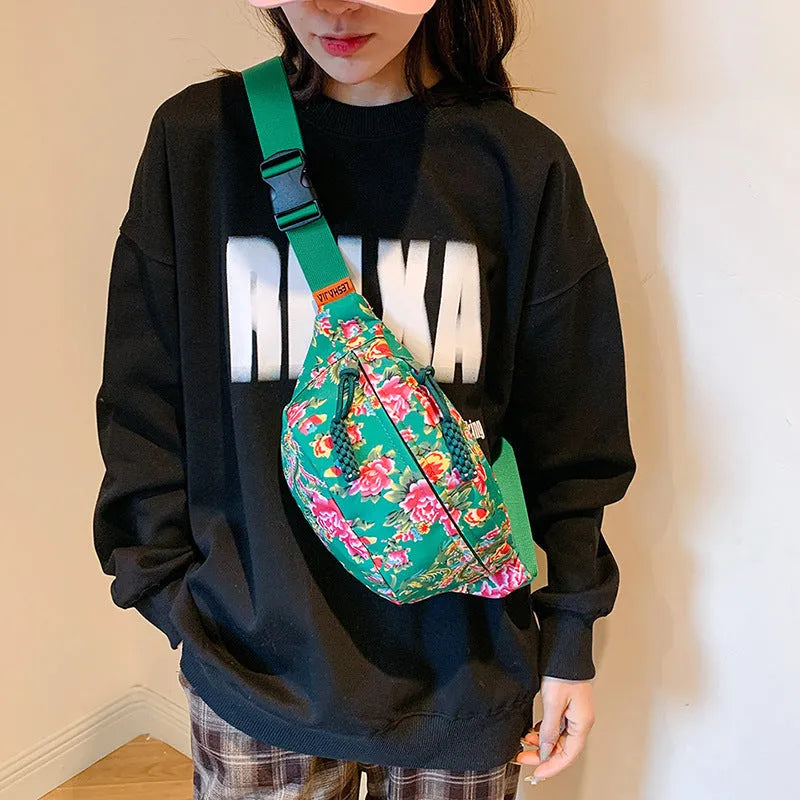 Western-style women's waist bag with large flower design and three-dimensional pockets.