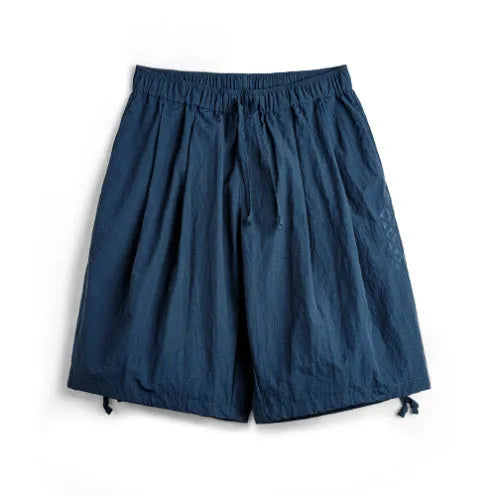 Men's embroidered loose fit beach shorts in Prussian blue colour, lightweight nylon fabric