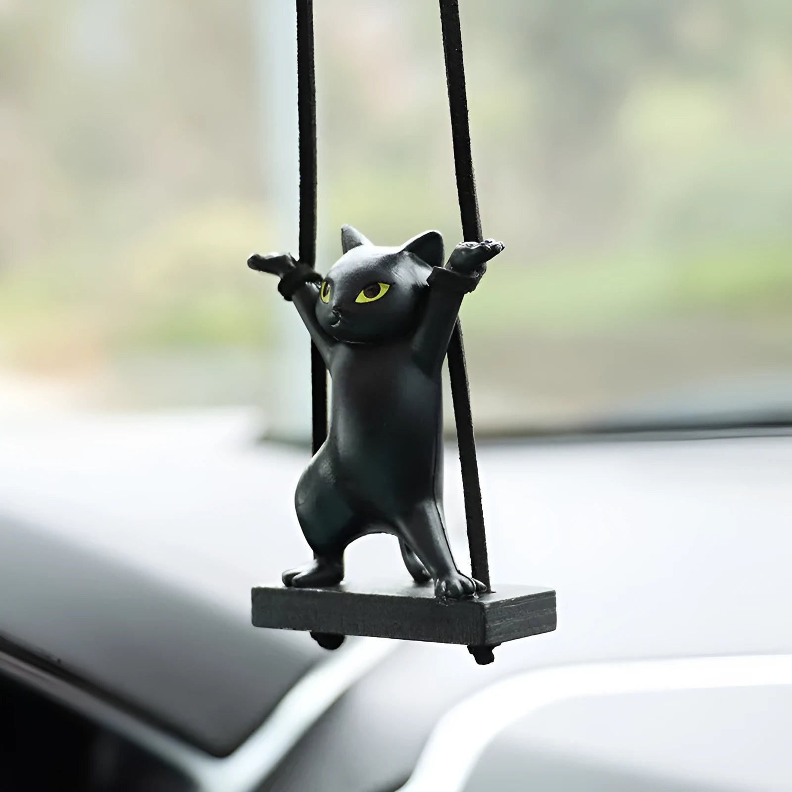 Cartoon-style resin cat pendant on a rope for car interior decoration