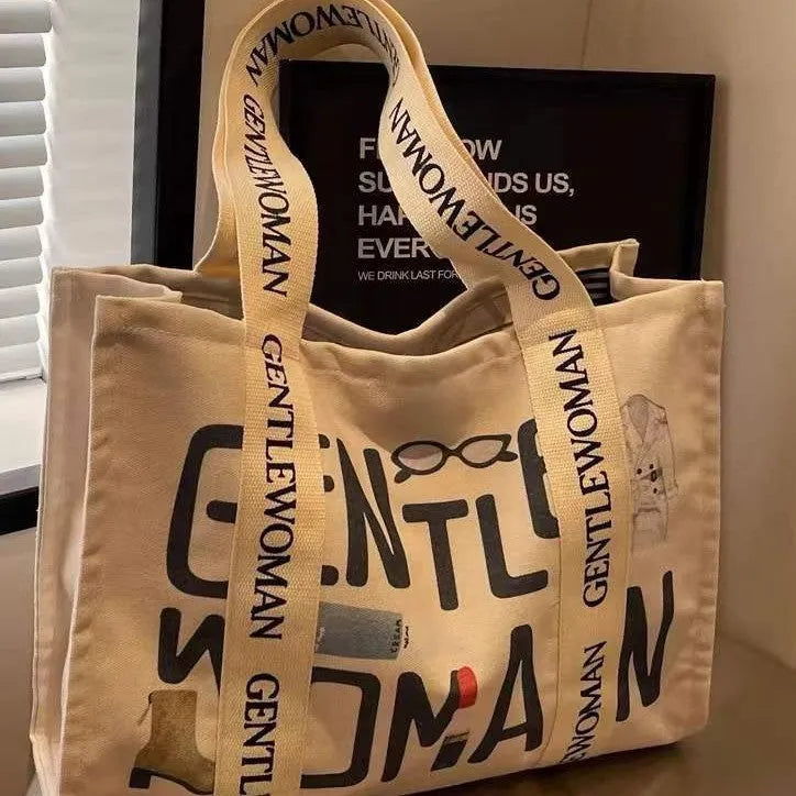 A large canvas tote bag with a printed design, shown in a choice of styles.