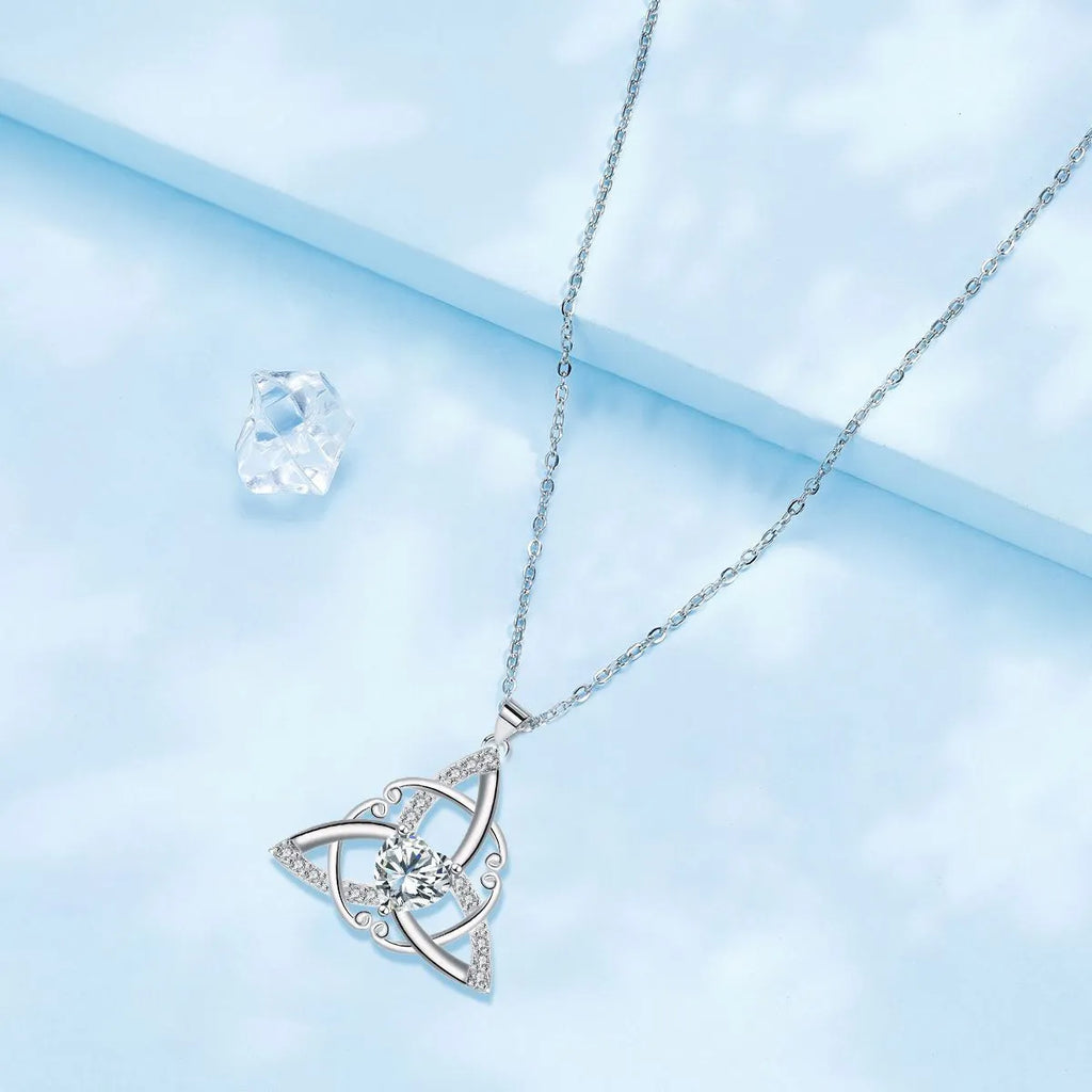 Women's geometric Celtic knot pendant necklace in electroplated copper, showing blue colour option.