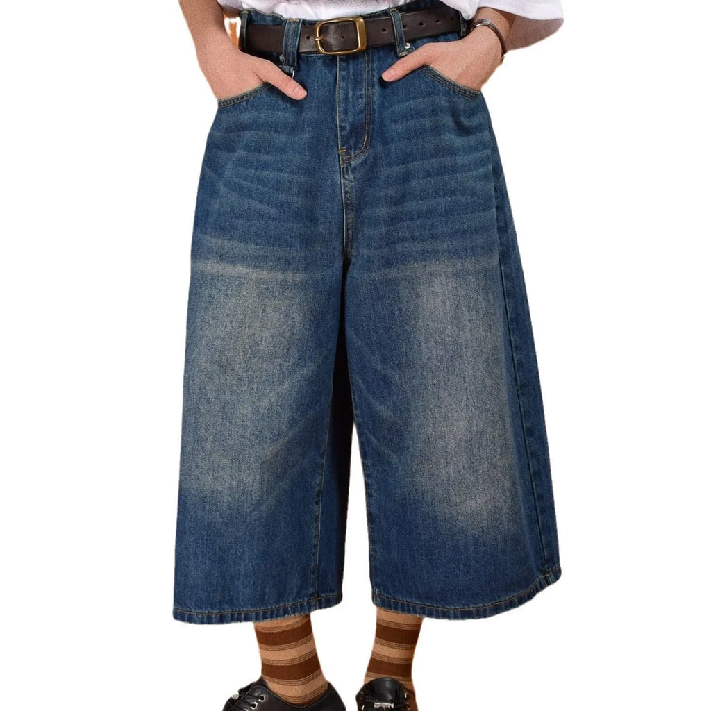 Men's straight-leg denim summer shorts in blue colour showing fifth-pant length and loose fit