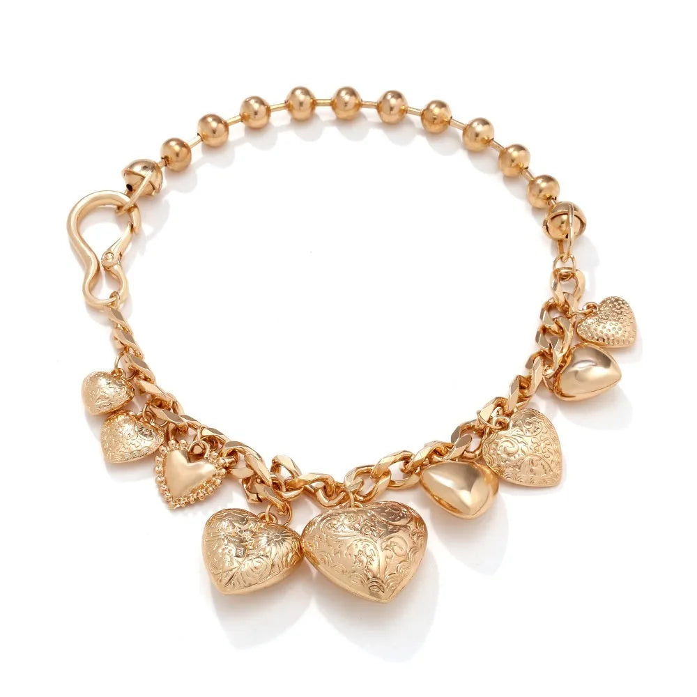 Gold carved heart pendant necklace on adjustable metal chain with exaggerated heart shape