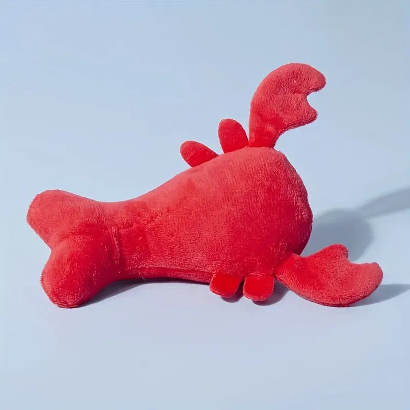 Red lobster-shaped squeaky plush dog toy for small and medium breeds.