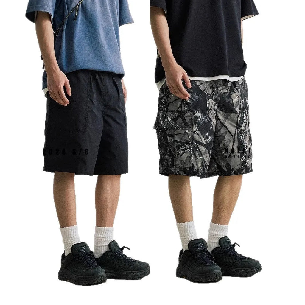 Man wearing loose straight-leg denim shorts with an elastic waistband in army green colour.