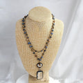 Tribal-style layered necklace with glass pendant and adjustable chain in beige or blue.