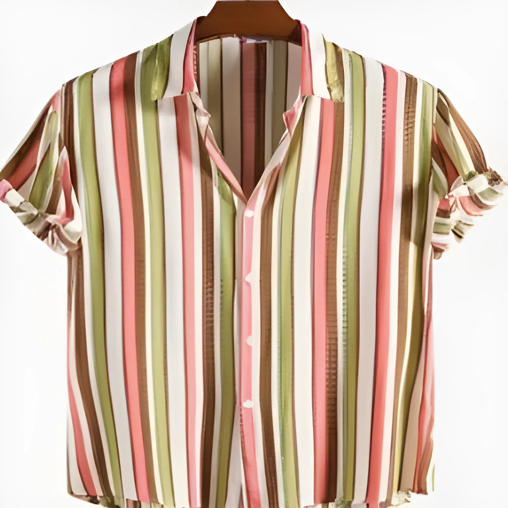 Man wearing a short sleeved shirt with a digital printed pattern, suitable for summer.