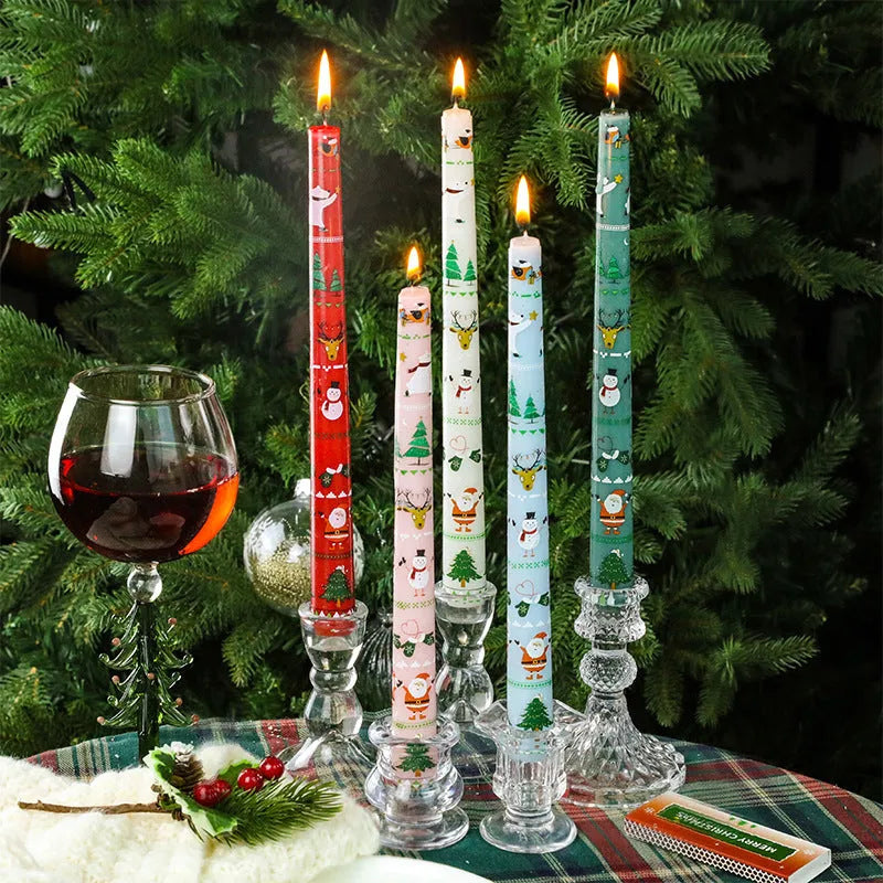 Christmas printed paraffin cylinder candle in bright red, 2.2x25cm, on a table