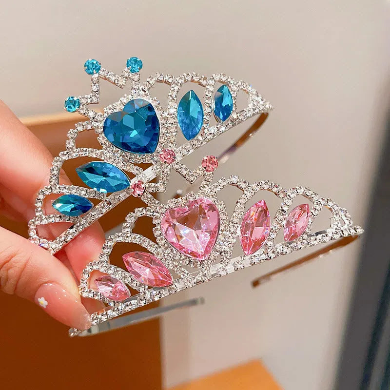 Children's electroplated alloy crown headband with pink crystals, shown on a model for scale.