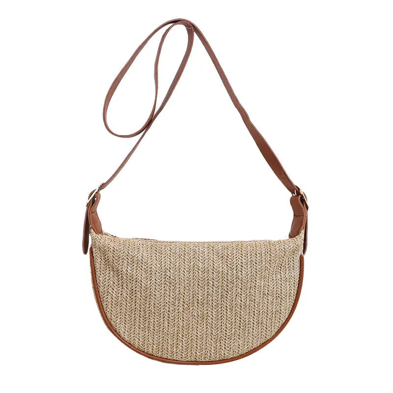 Women's straw woven crossbody bag showing internal phone and file compartments