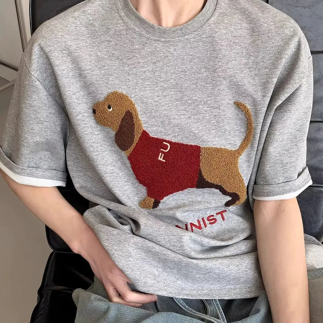 Grey men's cotton T-shirt with embroidered sausage dog and towel design on front.
