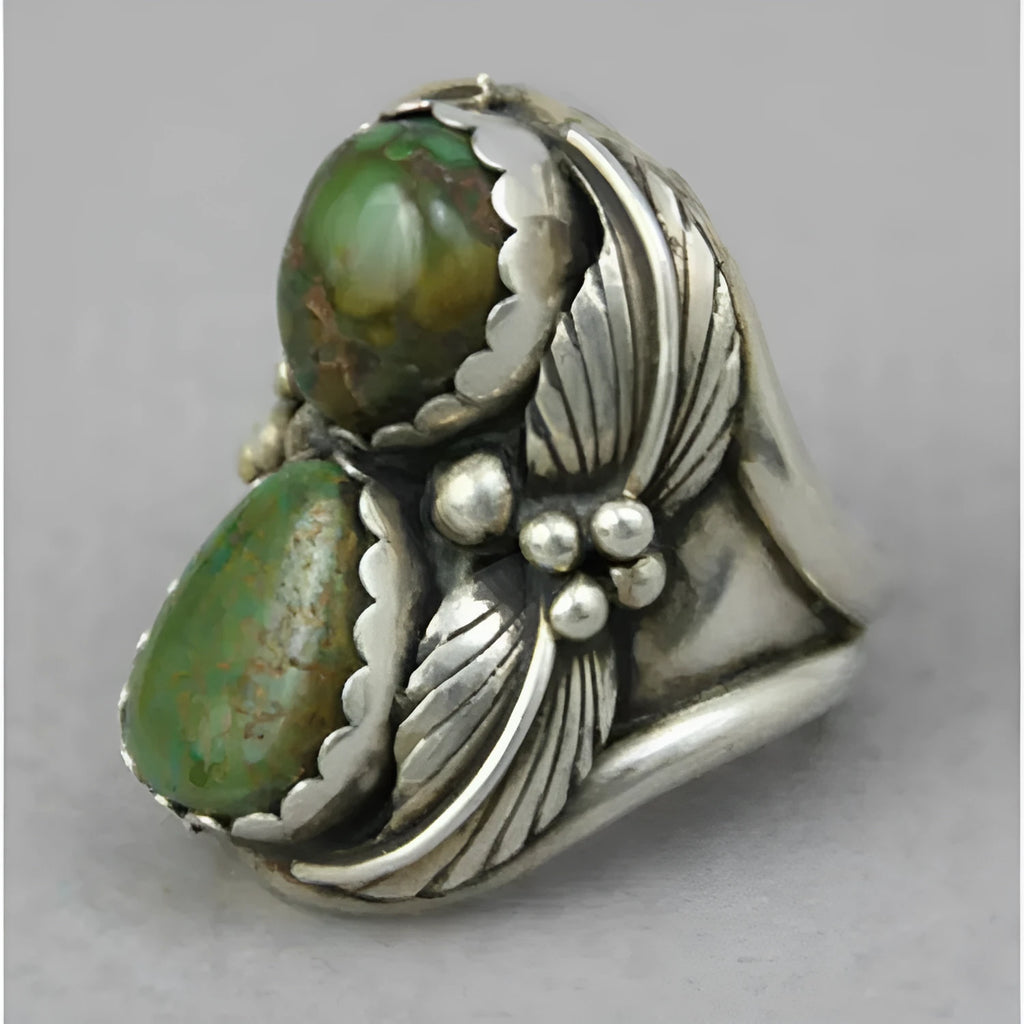 Turquoise geometric women's alloy ring with electroplated finish and retro styling on finger.