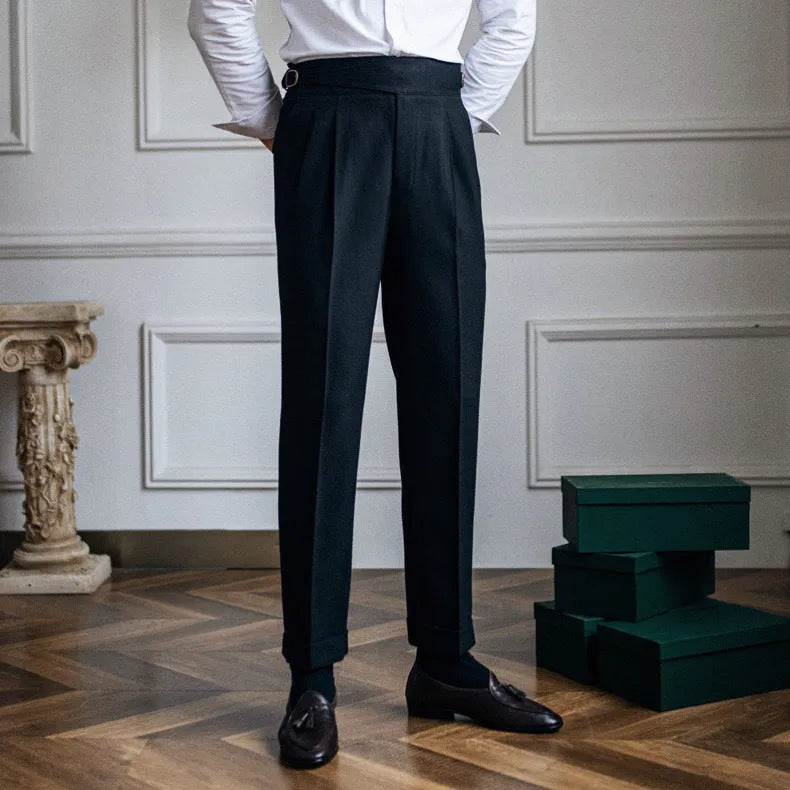 Man wearing high waist straight leg casual trousers in black polyester fabric.