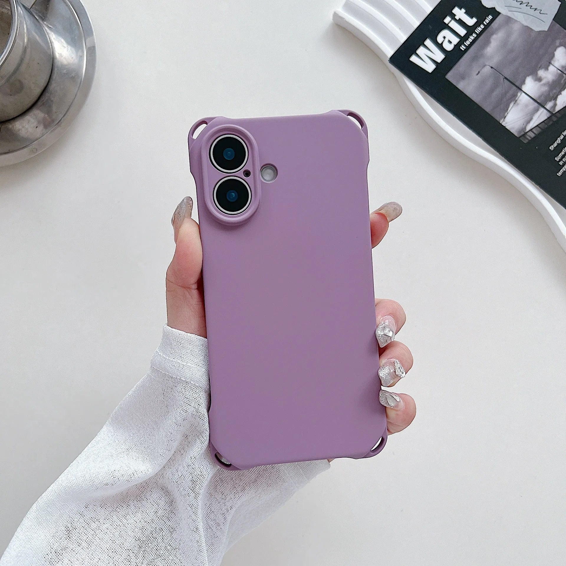 Four-corner cross lanyard liquid silicone phone case for Apple iPhone 16 in antique white with matching lanyard