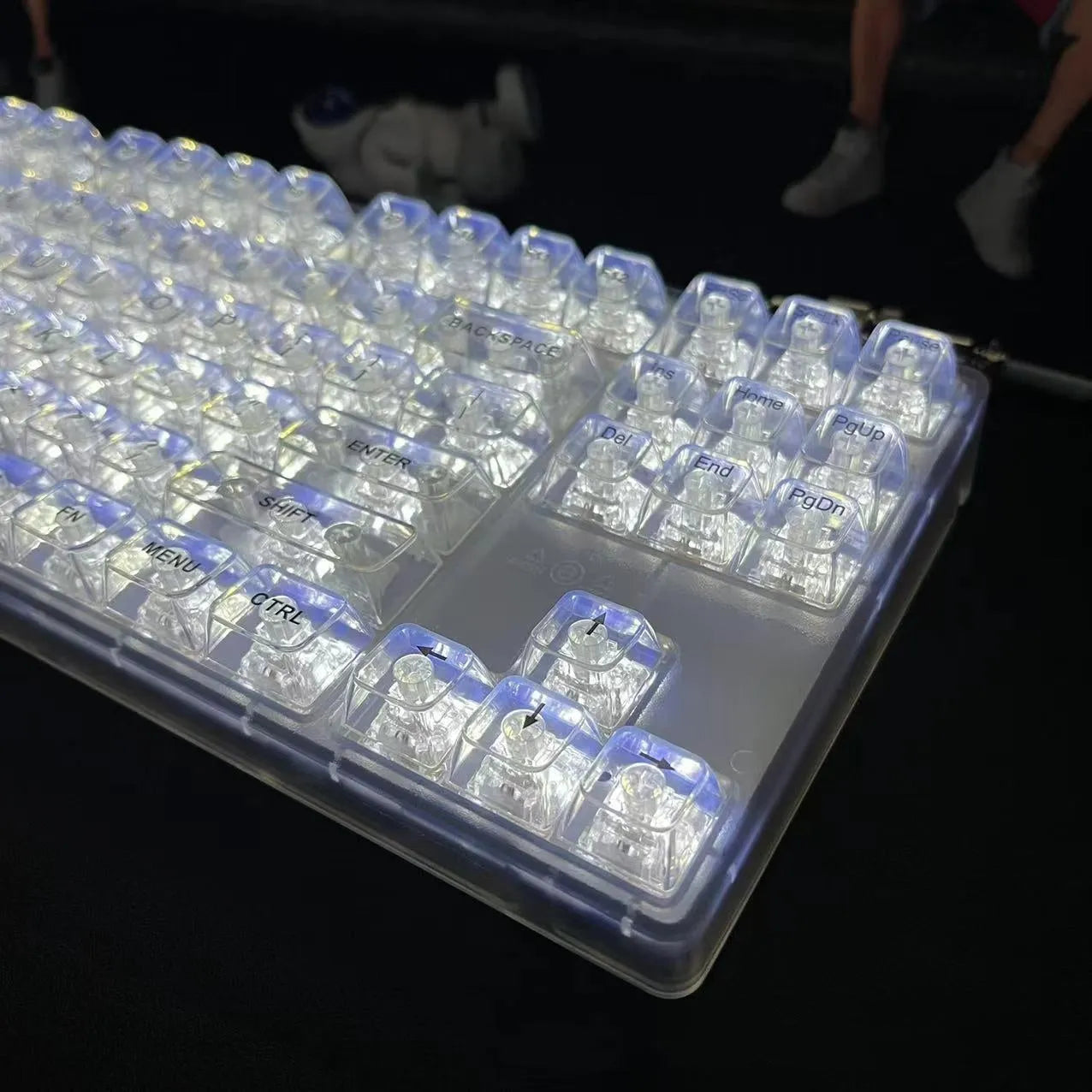Full set of 132 transparent plastic key caps for mechanical keyboards laid out.