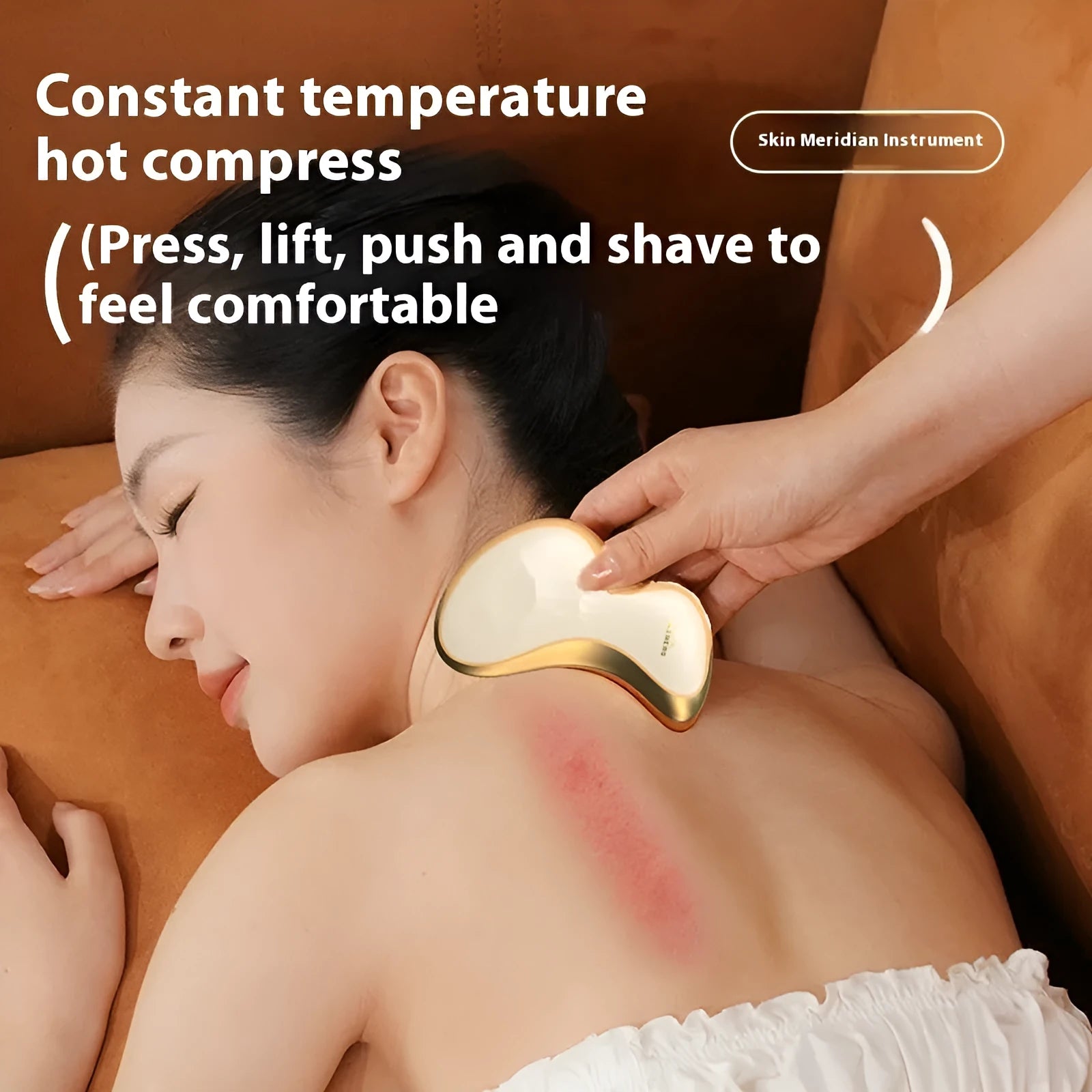 Electric gua sha scraping board with hot compress and vibration massage features in golden yellow finish