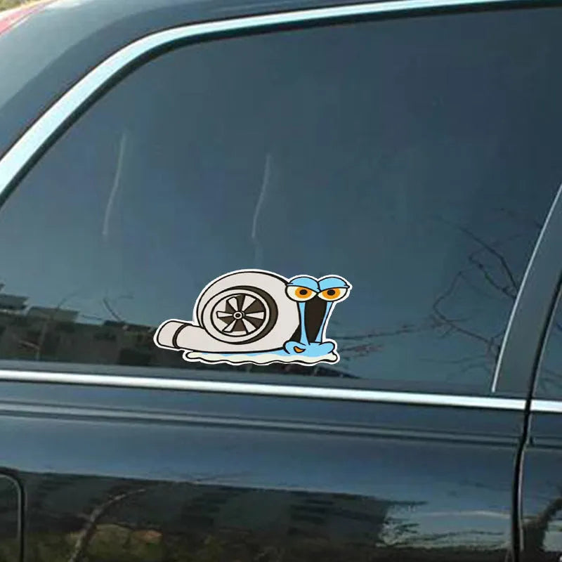 White reflective car sticker with a cartoon snail design, sized 12 by 8 centimetres
