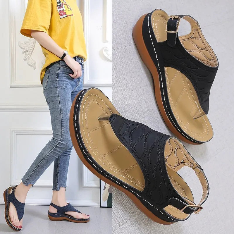 Women's casual wedge heel flip flop sandals with adjustable back strap in red vegan leather