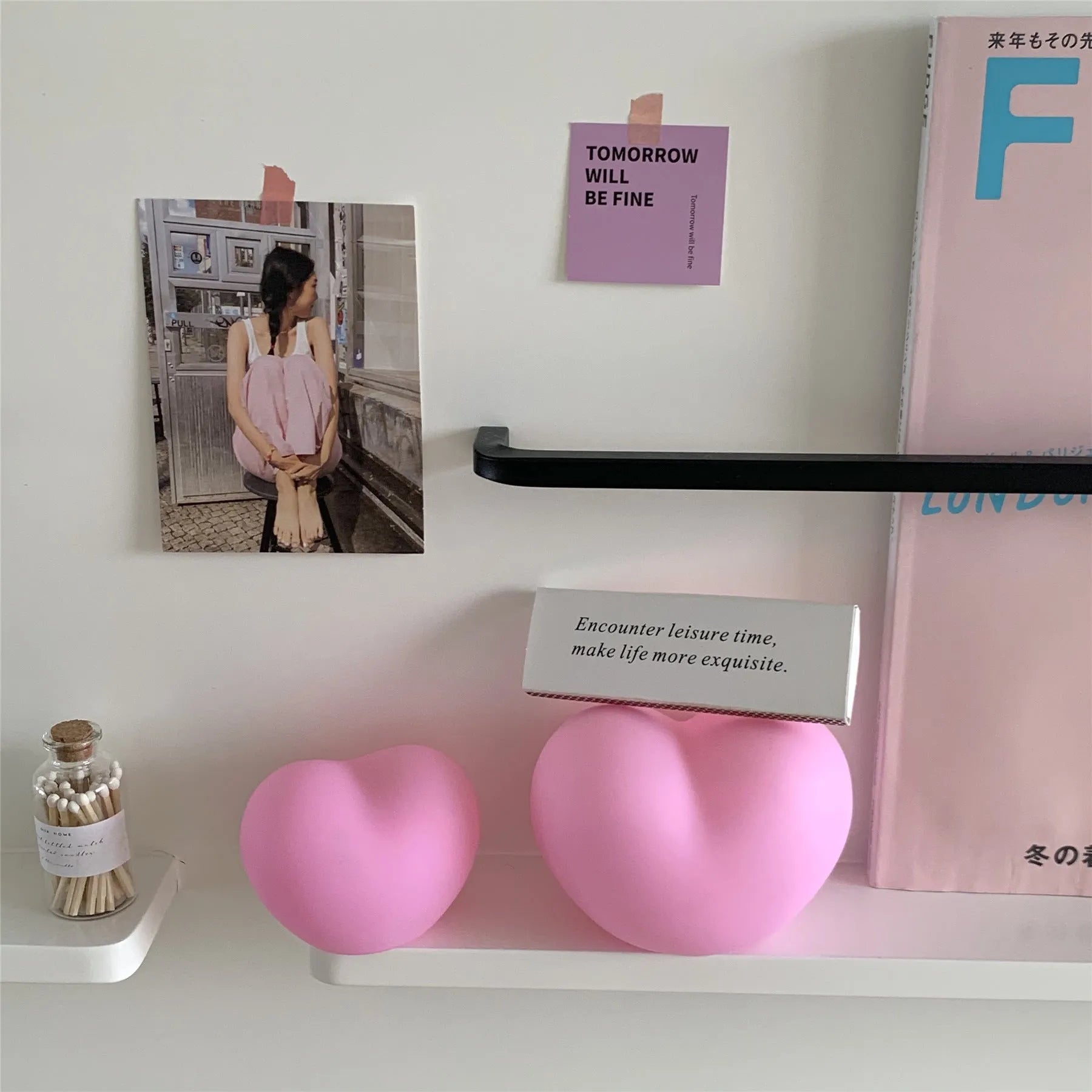 Pink and white vinyl atmosphere desk lamps in small and large sizes with warm LED glow.
