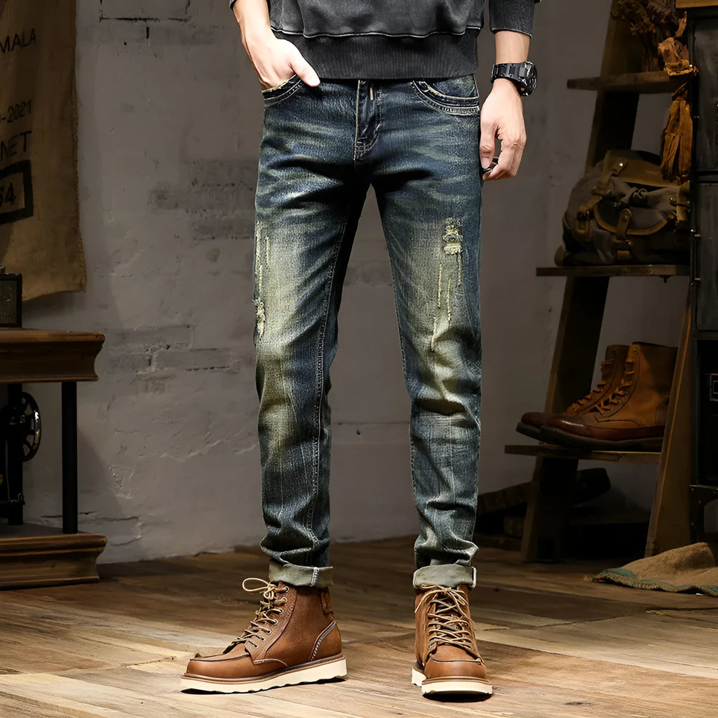 Men's retro blue stretch denim jeans with zip fly, shown in a slim-fit style
