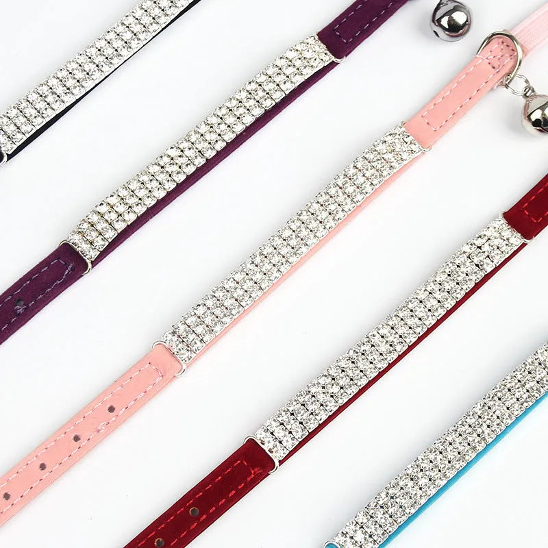 A velvet cat collar with rhinestone decoration, shown in one of five colour options.