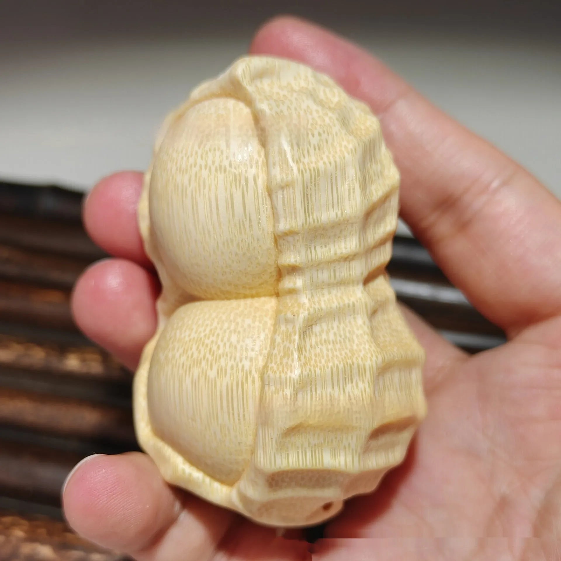 Natural solid bamboo peanut ornament with carving detail and modern simple style