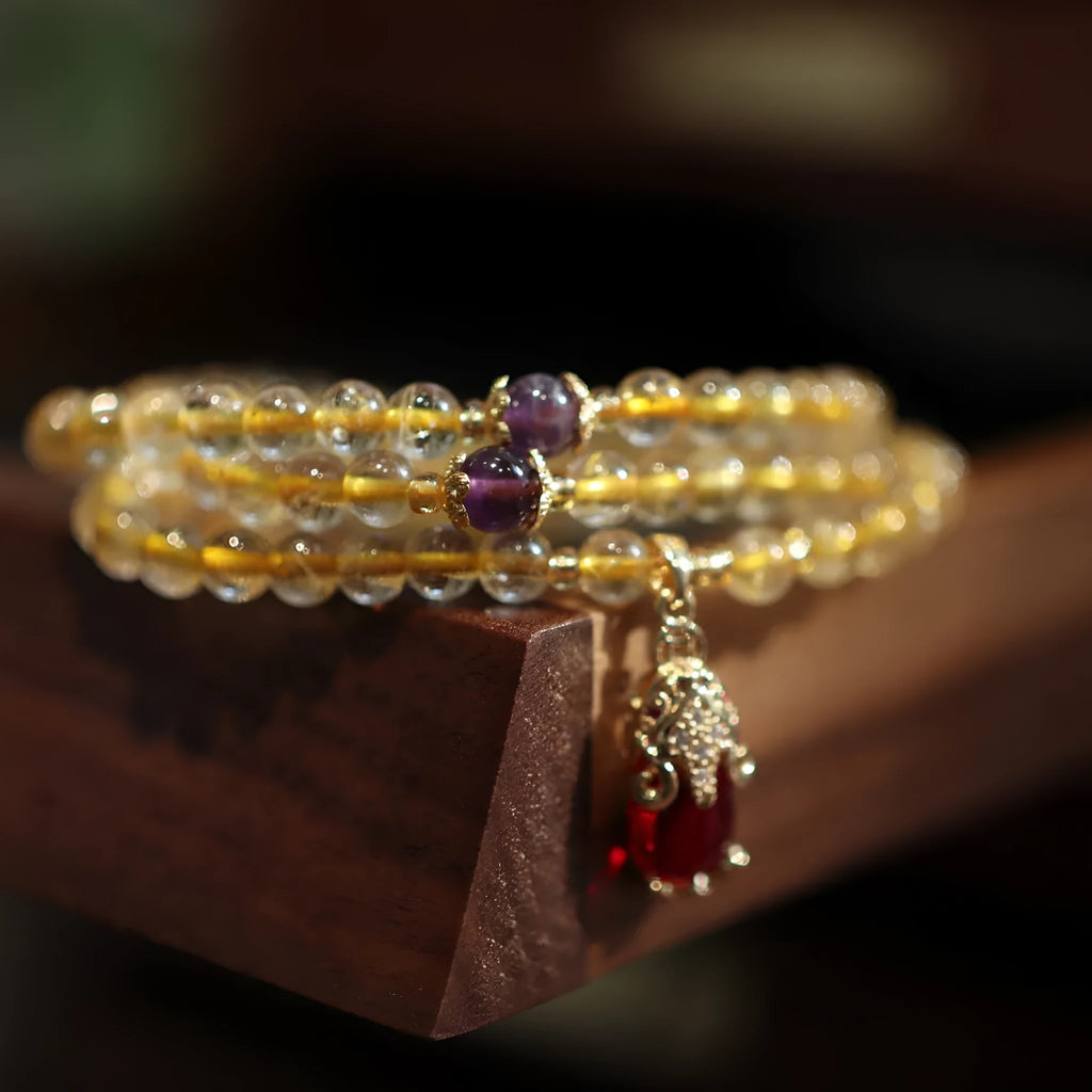 Natural Brazilian gold rutilated quartz bracelet with three circles and hanging chopsticks design