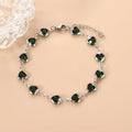 Stainless steel heart-shaped bracelet with electroplated geometric design in various colours like red, blue, and green for unisex wear.
