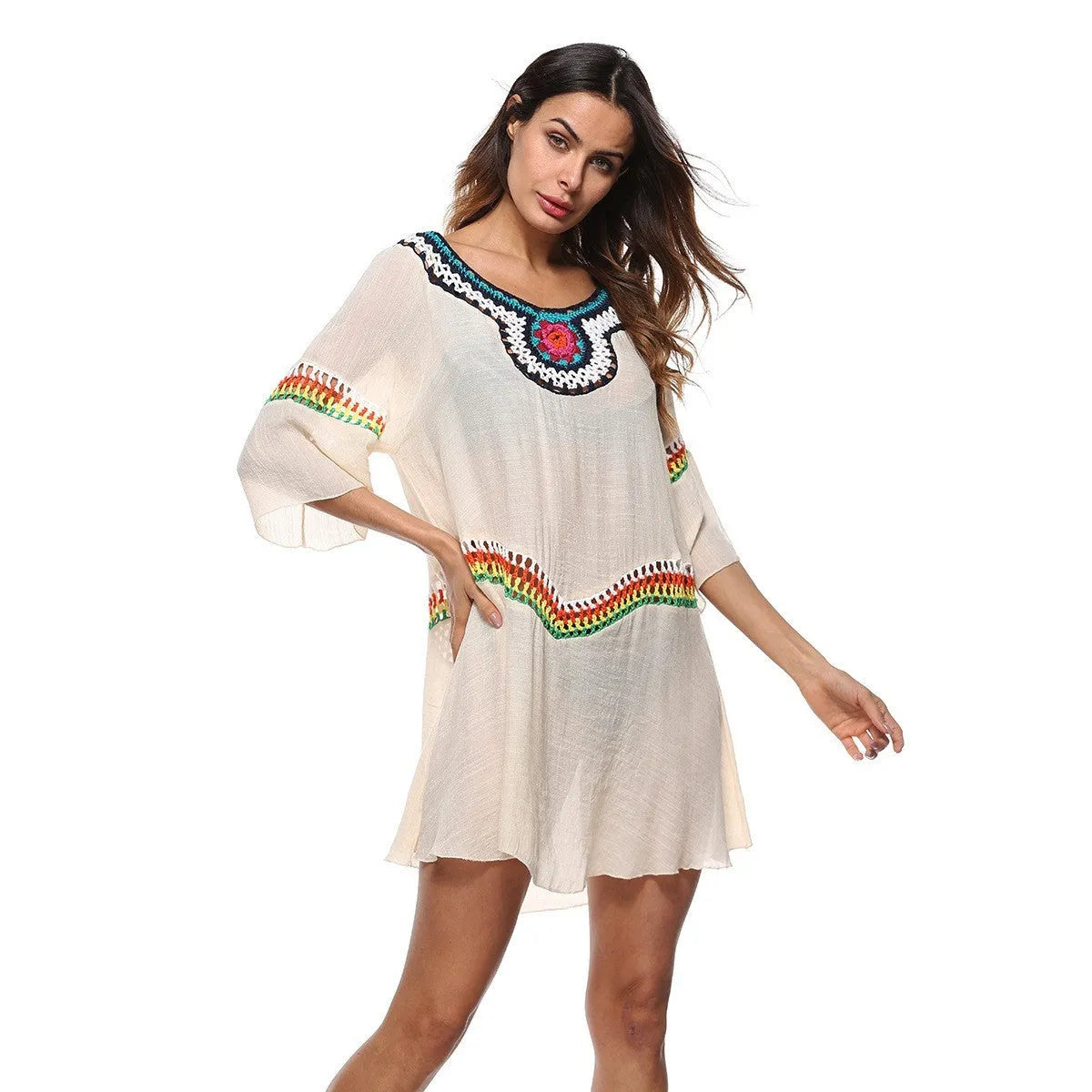 Crocheted white ethnic-style beach cover-up for women, shown as sun protection clothing.