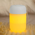 White cylindrical USB-powered small humidifier with aromatherapy function on wooden desk