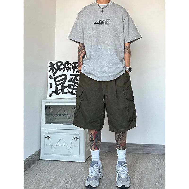 Men's straight-leg sports shorts in micro-elastic polyester fabric showing four colour options