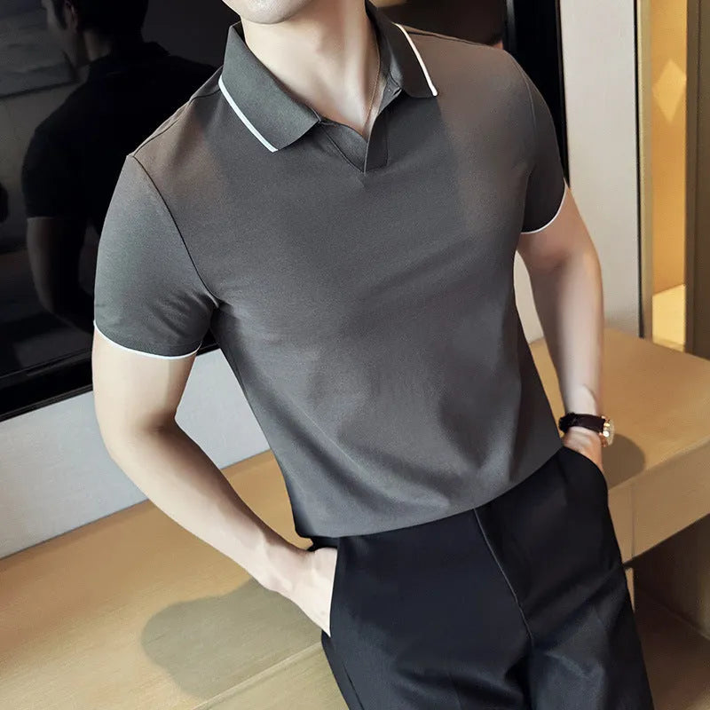Men's solid colour short sleeve polo shirt with lapel collar in a cotton blend fabric.