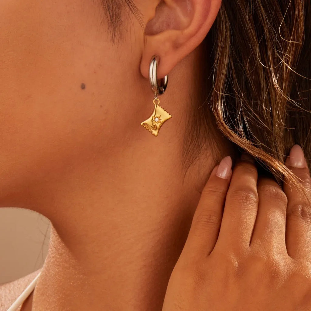 Christmas tree shaped stainless steel earrings with 18K gold electroplated finish and heart star geometric accents