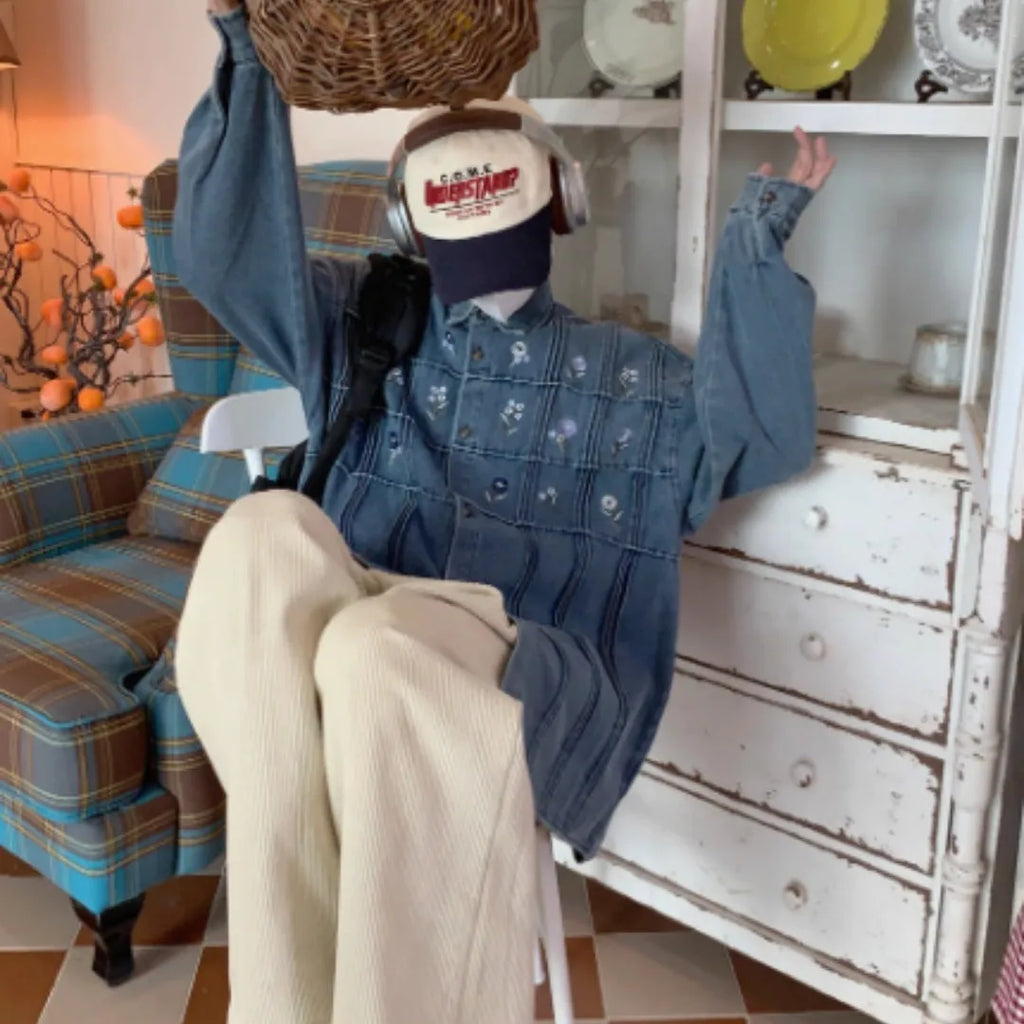 Vintage washed blue denim shirt with small floral print and pleated detail, long sleeves with button front
