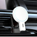Black and white magnetic wireless charger on a table with dimensions 85.2mm x 58.4mm x 29.5mm