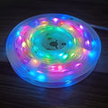 10-metre long multi-colour LED light string with 100 bulbs coiled on a table.