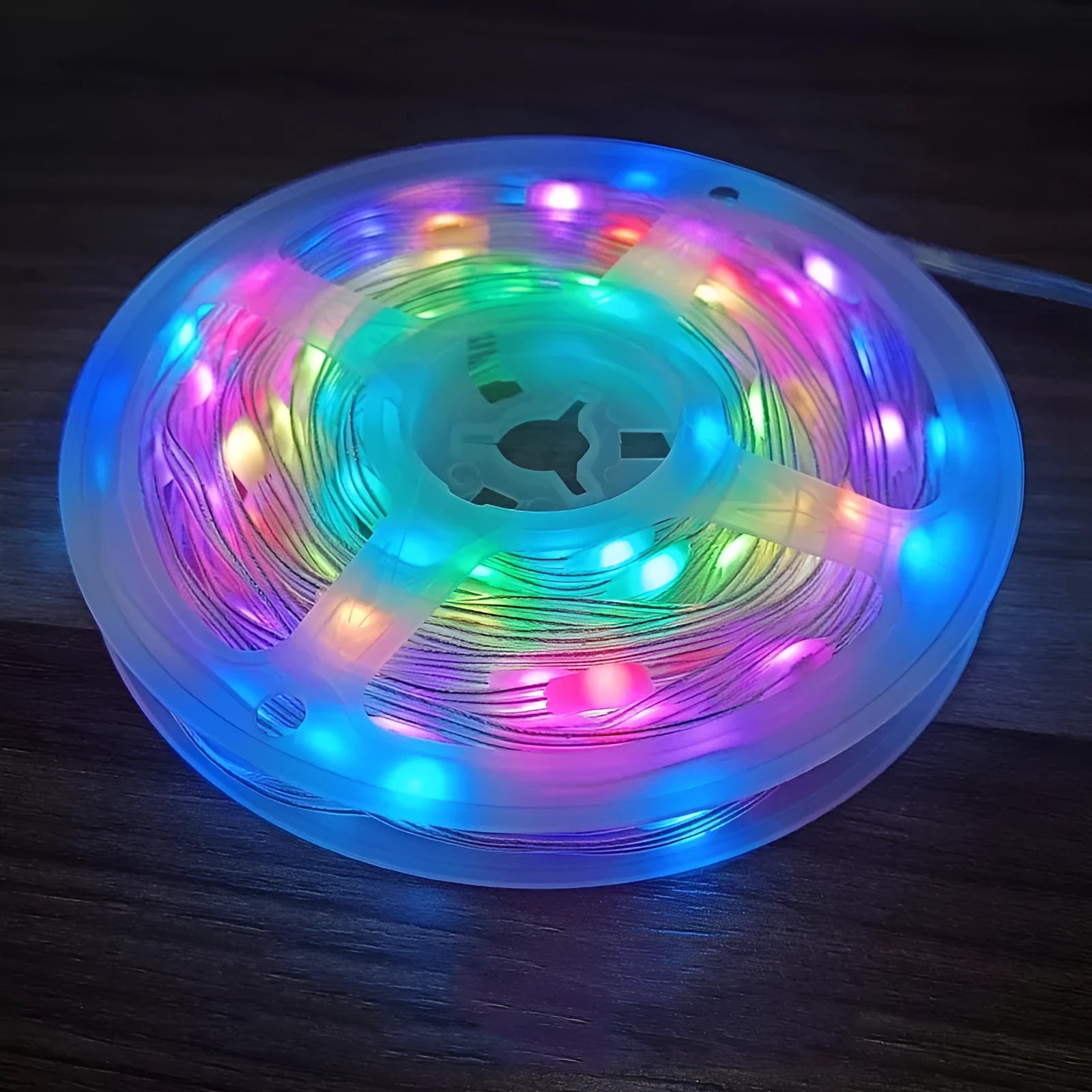 10-metre long multi-colour LED light string with 100 bulbs coiled on a table.