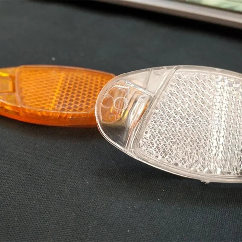 Bicycle spoke reflector in yellow or white measuring 7.2cm by 3.5cm with night warning film