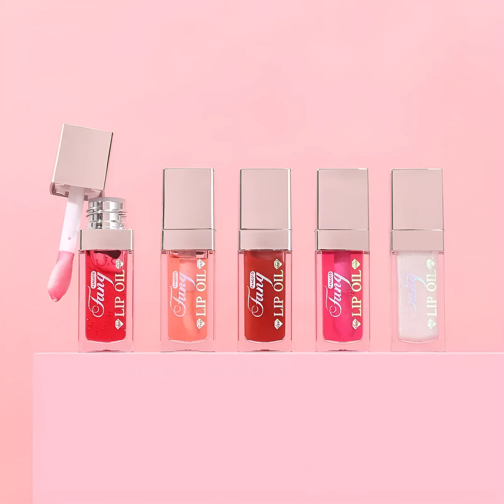 Mint lip gloss tube in one of five colours including bright pink, orange and dark red.