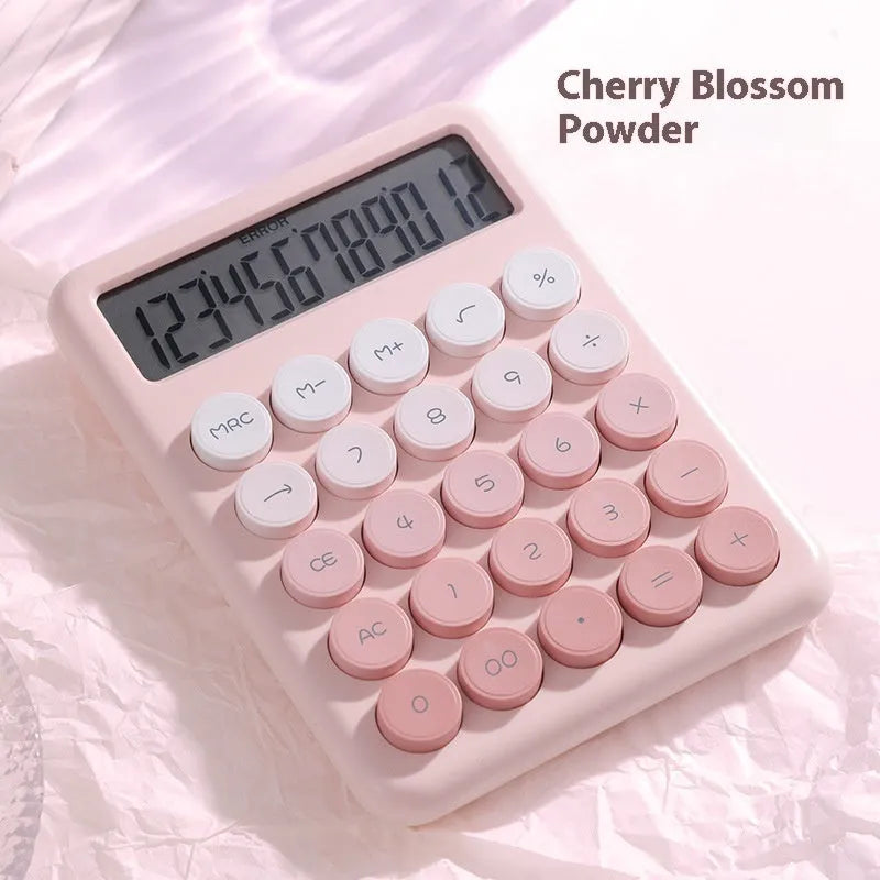 Gradient colour desktop calculator in four colour options on desk