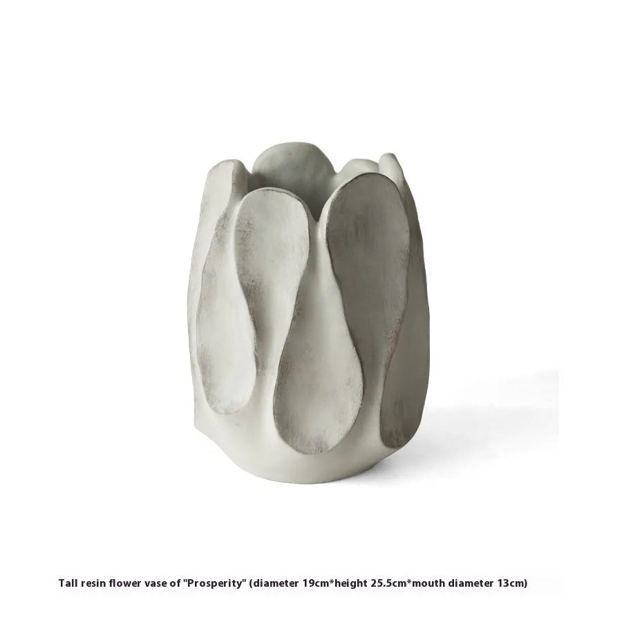 Irregular art ceramic vase in magnesium clay material displayed in high and low style options