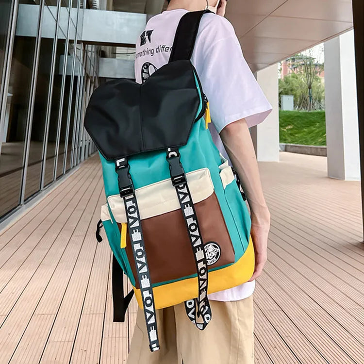 Oxford cloth school backpack showing three carrying methods with 32cm width dimensions