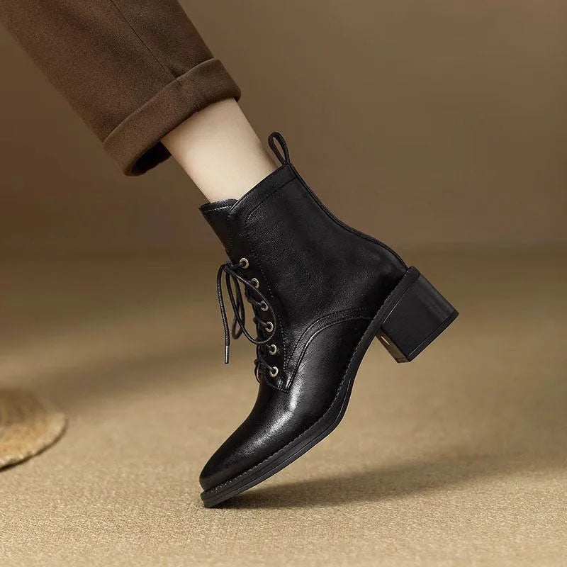 Women's black pointed-toe short tube boots with 5.5cm heel and velvet detailing on artificial PU upper