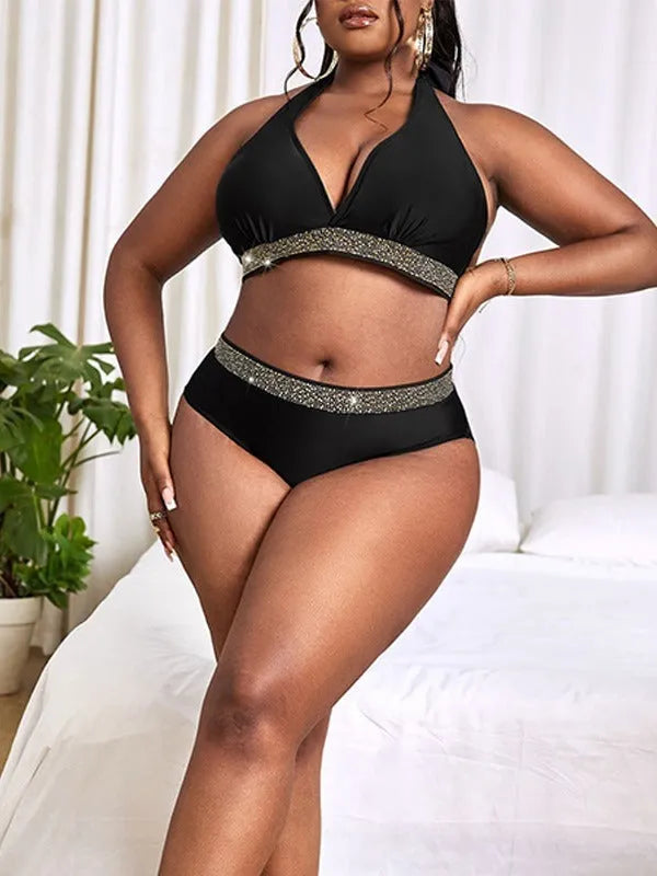Black plus size women's bikini swimsuit with bra and shorts on a mannequin.