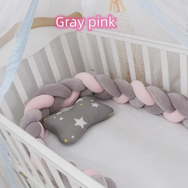 Baby crib bumper braid knot pillow cushion in spandex velvet, shown in a light grey colour