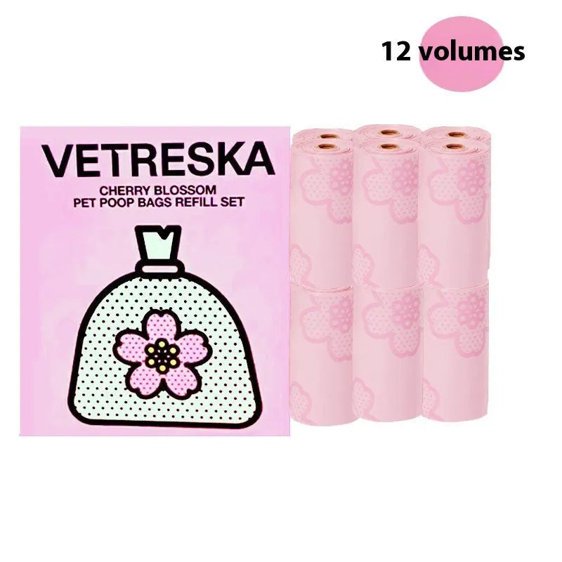 Portable plastic capsule dispenser for scented dog poo bags in strawberry, orange, and cherry blossom designs.