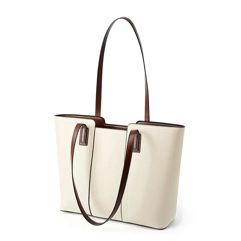 Black genuine leather women's shoulder bag showing multiple internal compartments and single strap