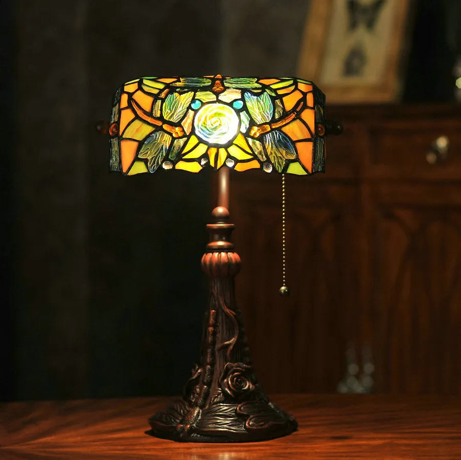 Tiffany table lamp with coloured glass shade on resin base, 36cm tall